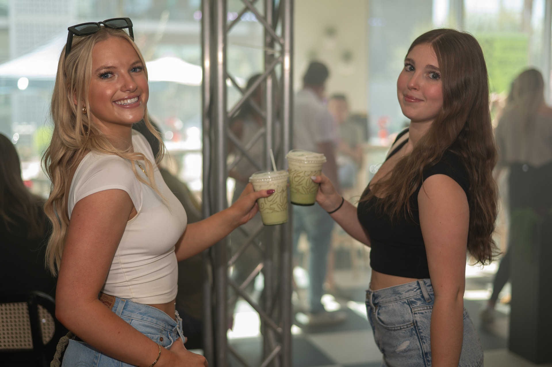 Guests toasting matcha lattes in the café